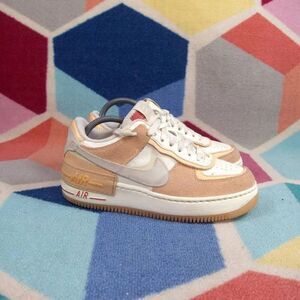 Nike Women’s Low-Top Sneakers in Peach and White